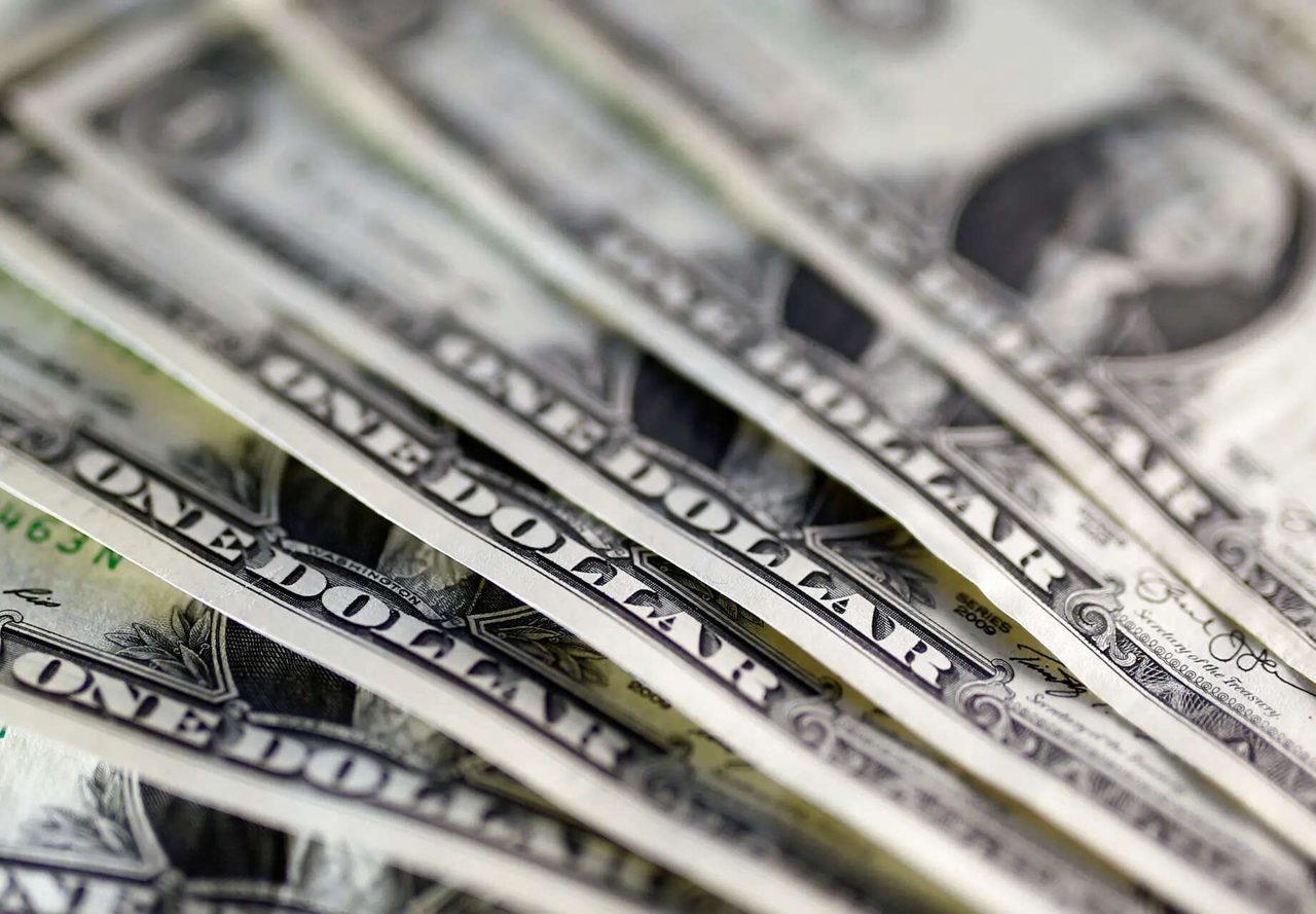 Dollar holds steady as Fed decision looms