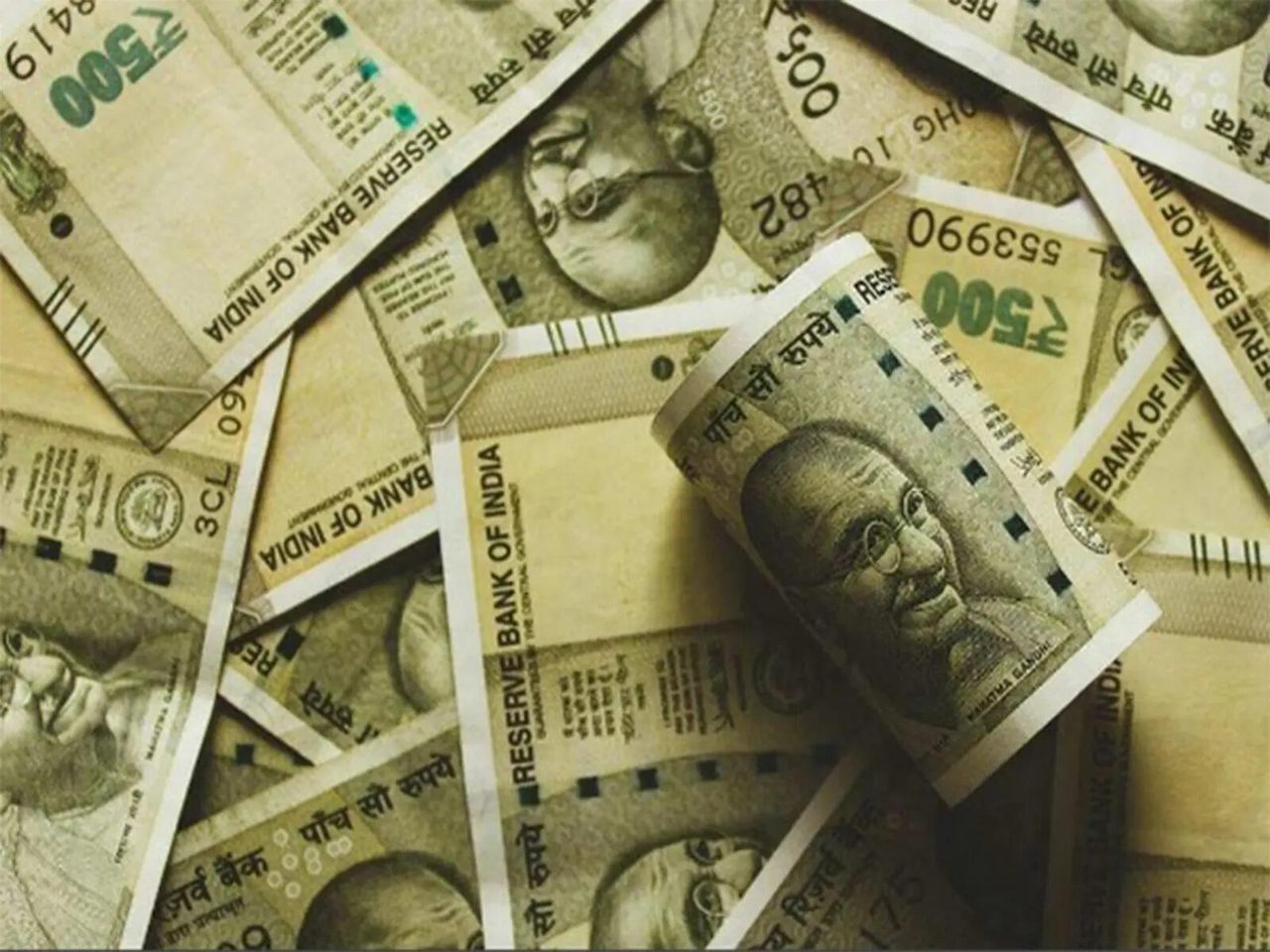 Competing cues, caution ahead of RBI policy decision keep rupee nearly flat
