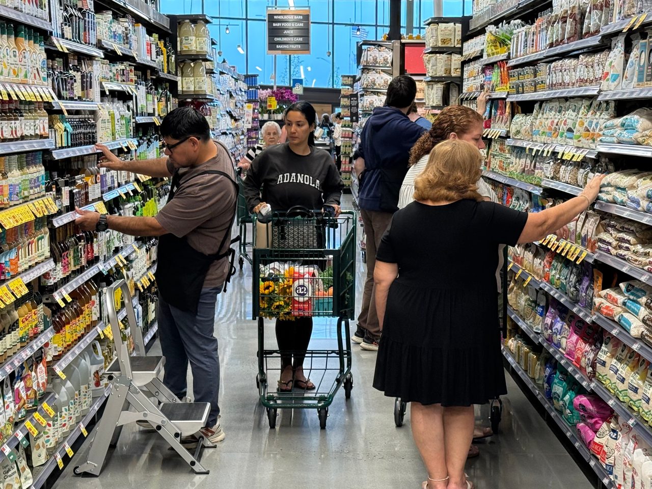 US inflation cooled again but still outpaced paychecks in July