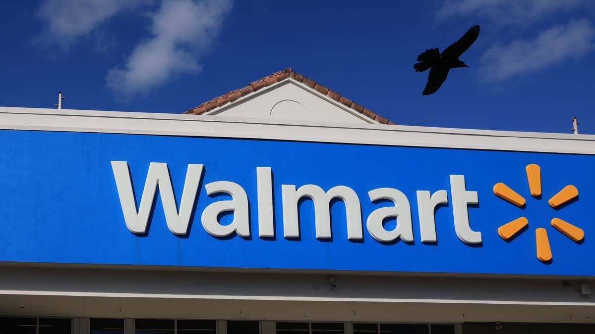 Walmart's $56 farmhouse cabinet has 4 compartments and a sliding barn door
