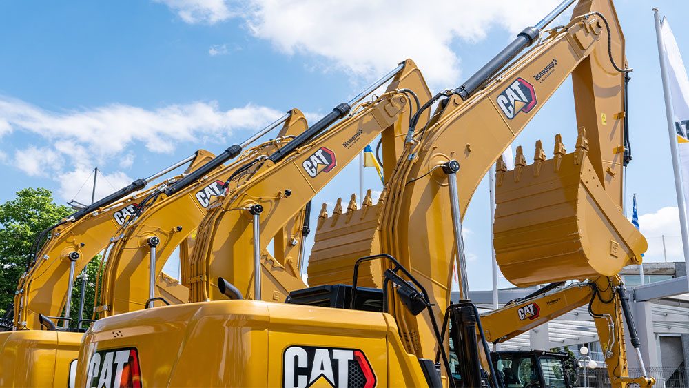 CAT Stock Lifts Dow Jones With Massive Earnings Beat
